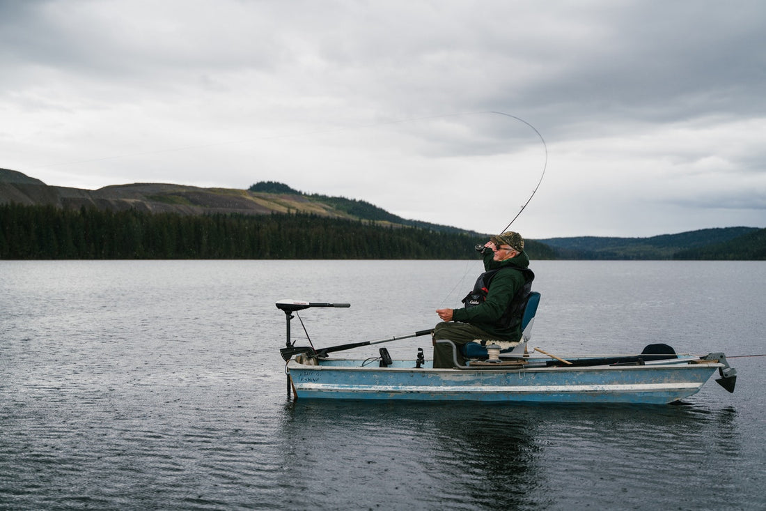 man fishing on boat