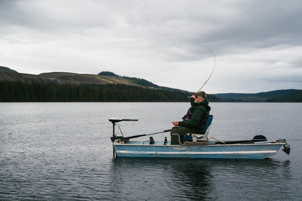 man fishing on boat