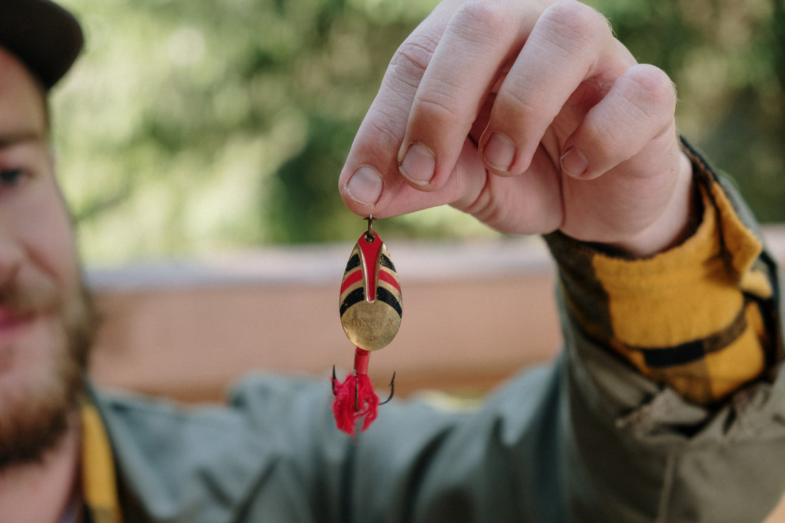 man holding fish hook